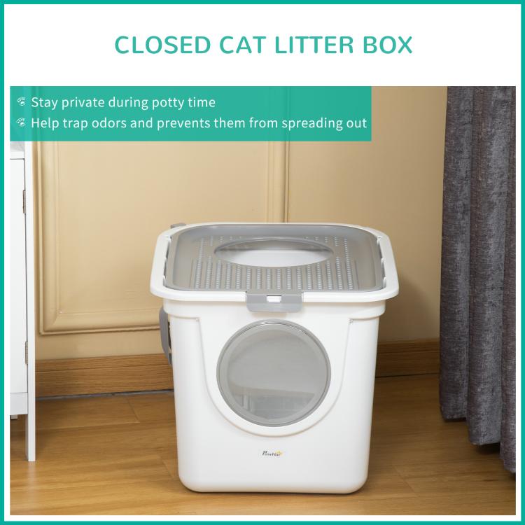 Closed white covered cat litter box with round front entrance and lidded top grate