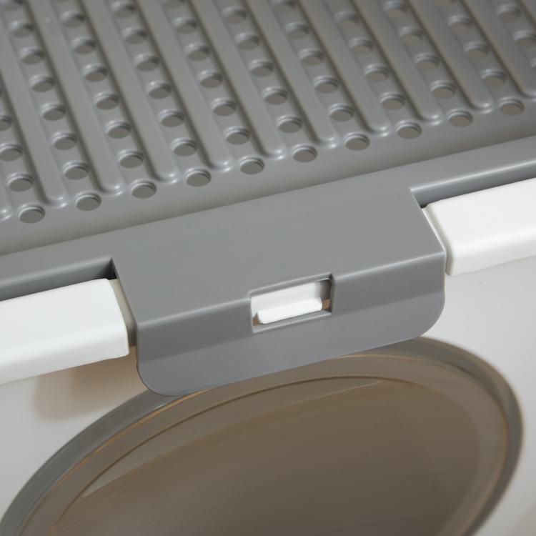 Gray sliding door flap latch on covered cat litter box front entrance