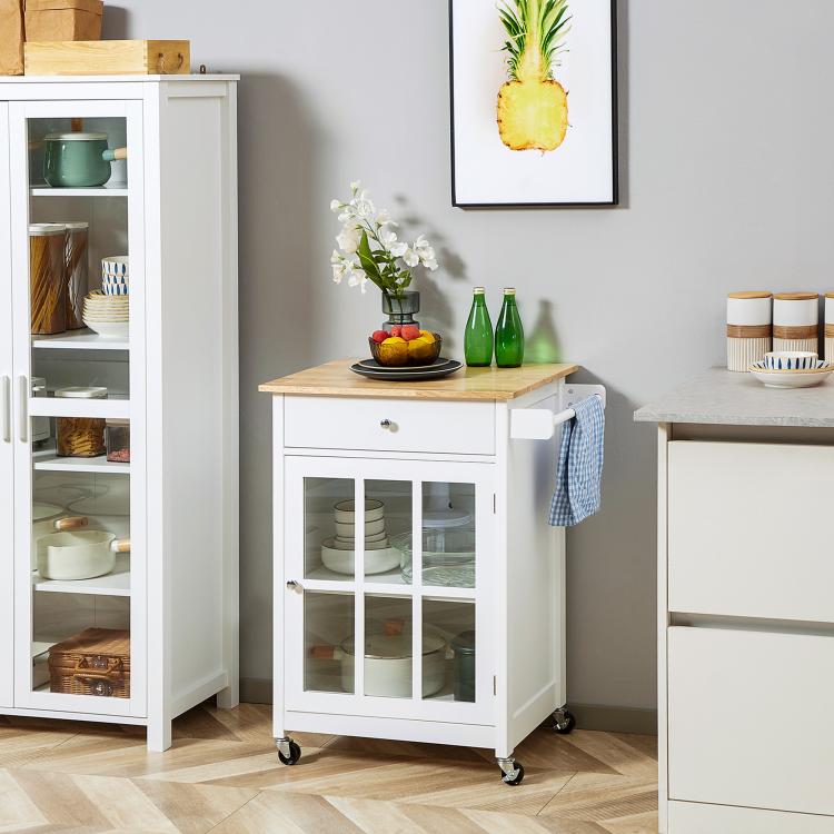 White rolling kitchen island cart with glass door cabinet, drawer, and wooden tabletop