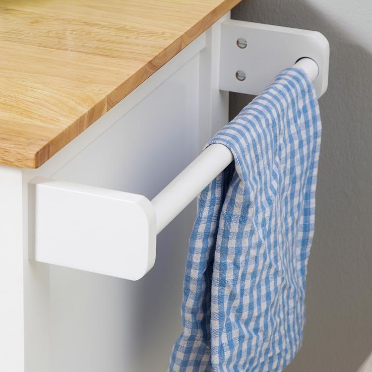 White cart towel rack holding a blue striped towel, beside the drawer