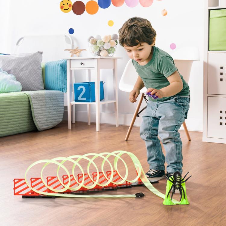 Kids’ glowing race track set with pull-back car and green spider figure