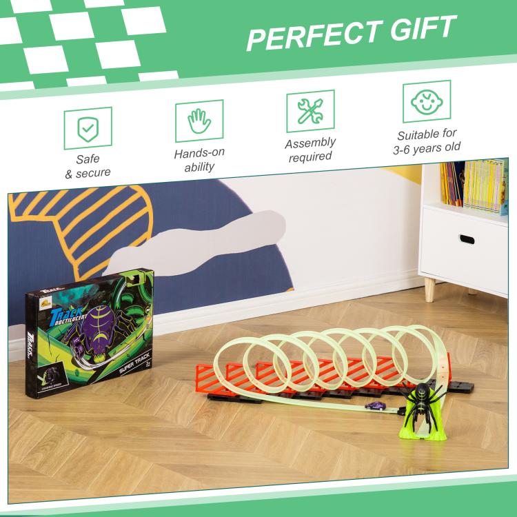 Glowing race track set with pull-back car and green spider figure on playroom floor