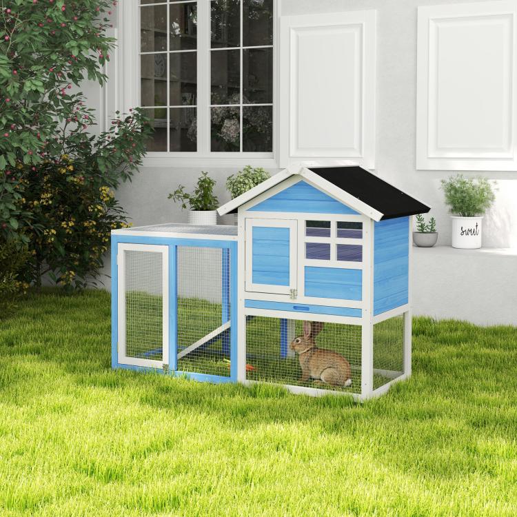 Light blue and white outdoor rabbit hutch with wire doors and black roof