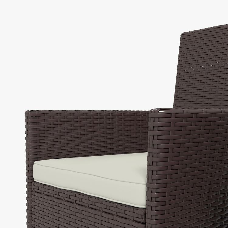 Close-up of dark coffee woven wicker outdoor chair arm and seat cushion