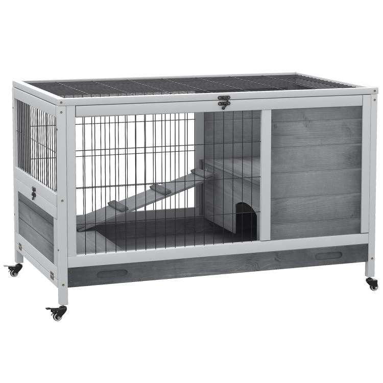 Indoor wooden rabbit hutch with enclosed run, wire panels, and caster wheels