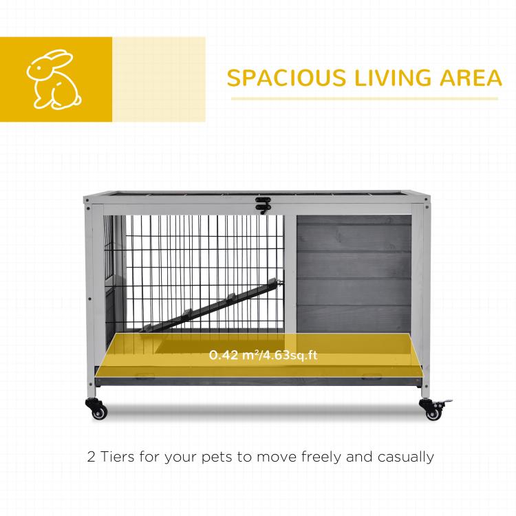 Indoor wooden rabbit hutch on casters with wire pen and solid gray side panel