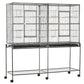 Rolling metal bird cage with two doors and bottom storage shelf on wheels