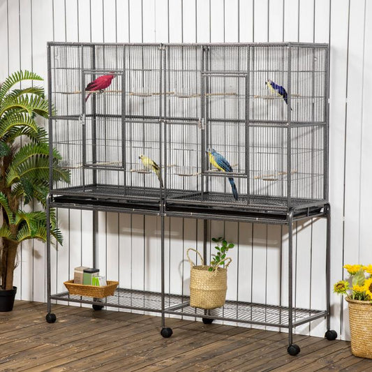 Rolling bird cage with storage shelf, wire enclosure and wooden perches, multiple birds inside