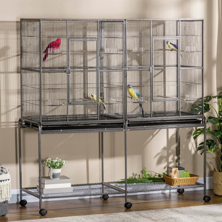 Rolling bird cage with wire enclosure and wooden perches, colorful birds perched inside
