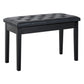 Black button-tufted padded piano bench with wooden legs