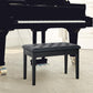 Black tufted piano bench with faux leather seat and sturdy wooden frame