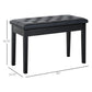 Black tufted piano bench with padded faux leather seat and wooden legs