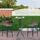 Outdoor bistro set with two gray sling bar stools and round glass bar table