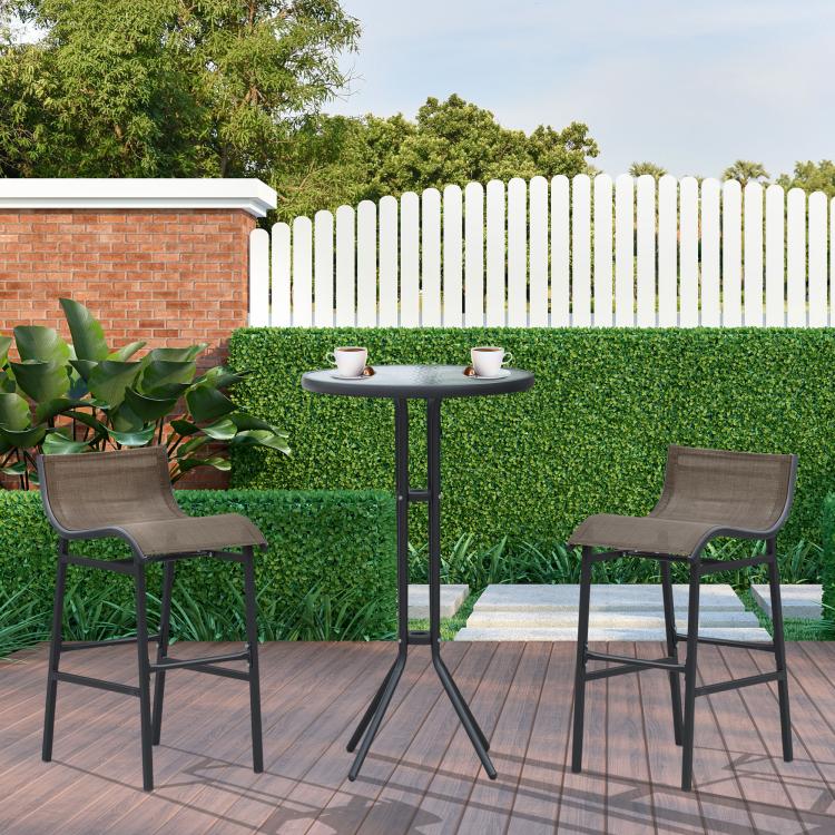 Outdoor bistro set with two gray sling bar stools and round glass bar table