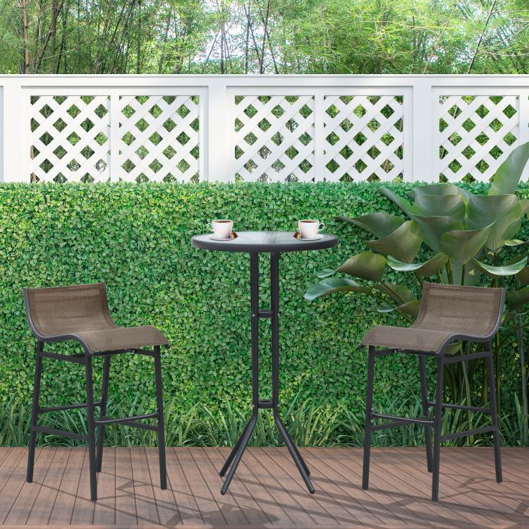 Outdoor bistro set with round glass bar table and two gray sling bar stools