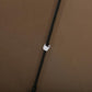 Coffee cantilever patio umbrella pole with fabric strap detail