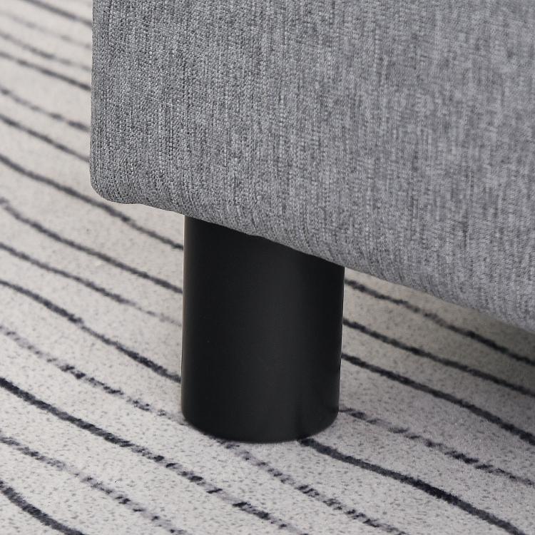 Gray linen footstool with black plastic cylindrical leg