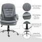 Grey upholstered high-back chair with thick padding, gas-lift base, and swivel casters