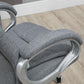 Grey upholstered chair seat and armrest with curved metal frame detail