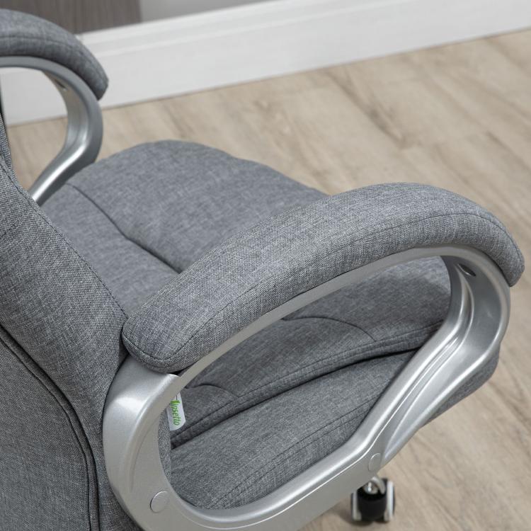 Grey upholstered chair seat and armrest with curved metal frame detail