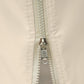 Beige gazebo sidewall panel detail: zipper track with metal hook and C-ring
