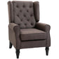 Button-tufted wingback lounge chair with round arms and black legs, tufted gray upholstery
