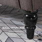 Close-up of dark turned chair legs on patterned floor