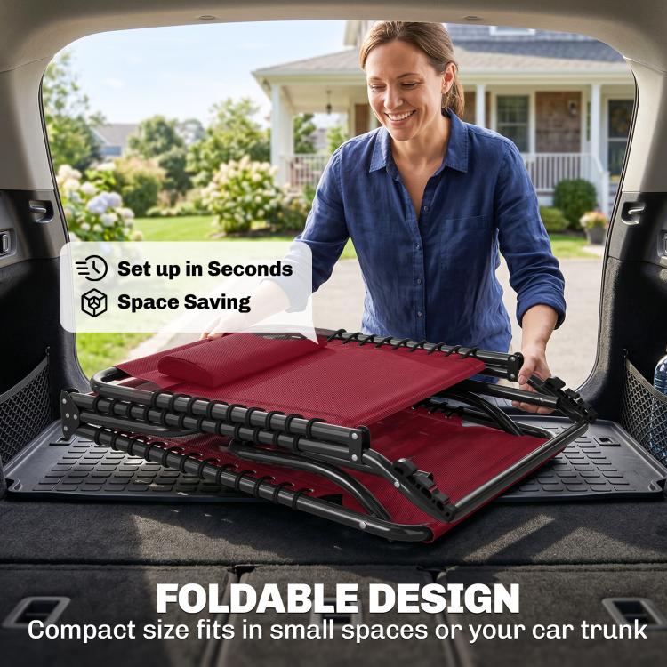 Wine red folding chaise lounge unfolded in trunk, black frame and bungee seat