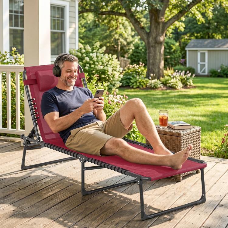 Wine red chaise lounge with black frame, bungee seat, and padded headrest