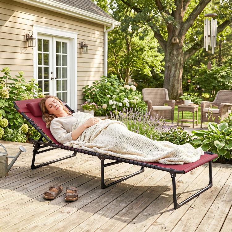 Wine red reclining chaise lounge chair with black metal frame and padded headrest