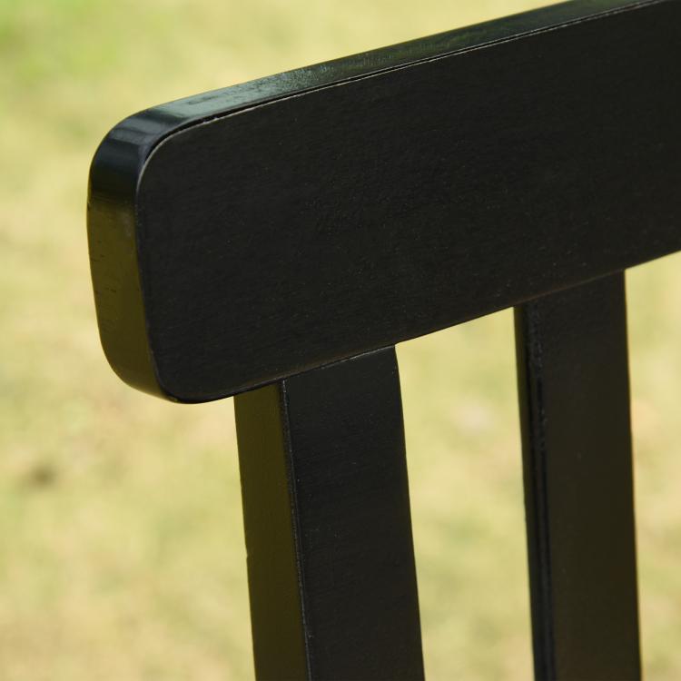 Black porch swing armrest and slatted back support, rounded end close-up