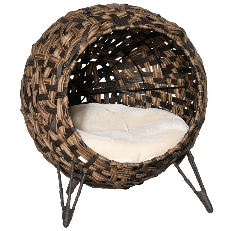 Round woven elevated cat bed with dark brown basket frame and cream cushion