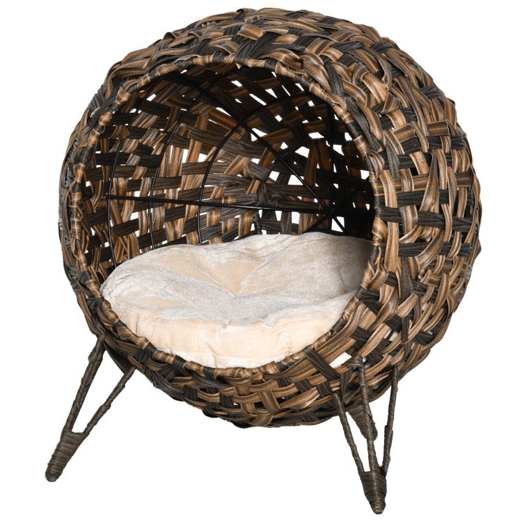 Elevated woven cat house with dark brown basket weave and cream upholstered cushion