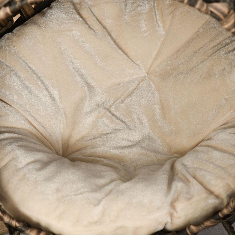 Woven cat bed cushion close-up with beige fabric filling
