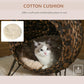Woven cat bed with soft cotton cream cushion, cat lounging inside