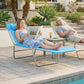 Blue outdoor chaise lounge with pillow and reclining back on a steel frame