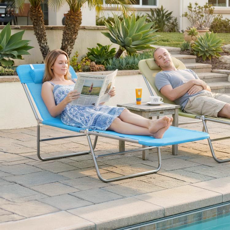Blue outdoor chaise lounge with pillow and reclining back on a steel frame