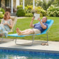 Blue chaise lounge chair with pillow and reclining back near a swimming pool
