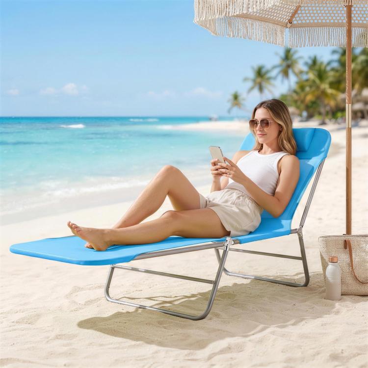 Blue folding chaise lounge chair with pillow and reclining back on a steel frame