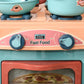 Kids play kitchen food stand front panel with 'Fast Food' sign and two knobs