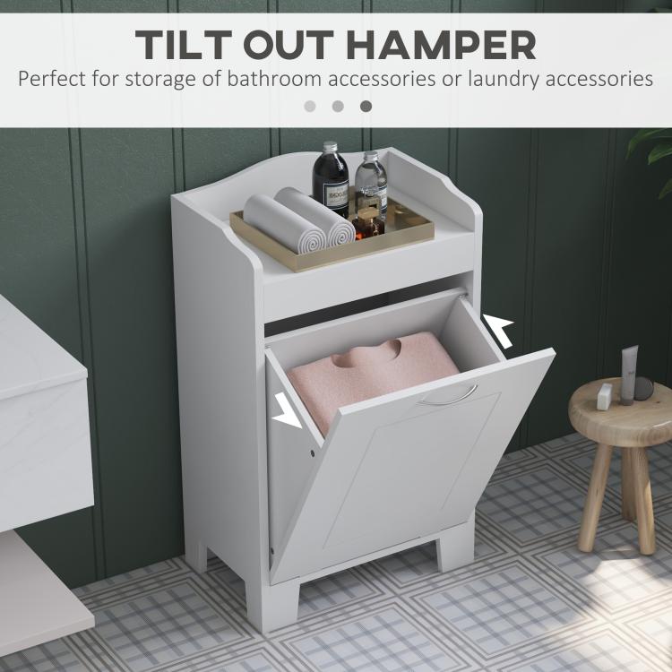 White tilt-out laundry cabinet with open hamper drawer and curved top shelf