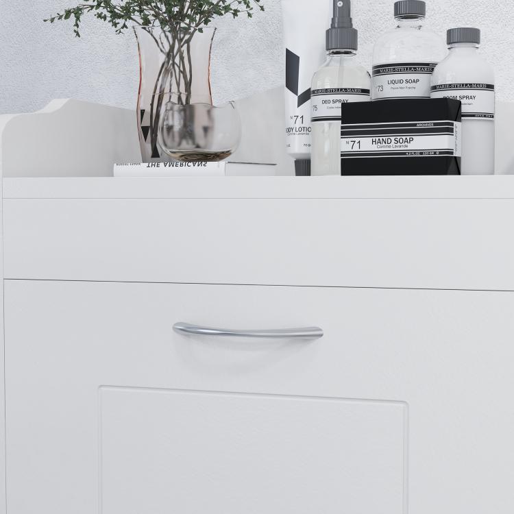 Close-up of white cabinet front with curved metal handle and recessed door panel