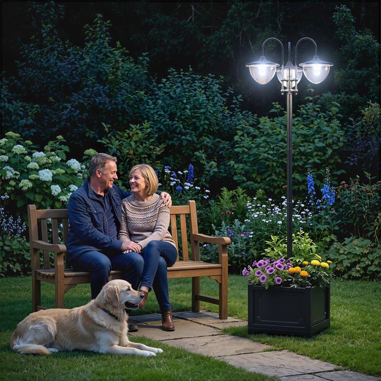 Three-head solar lamp post light with frosted glass shades beside a flower planter