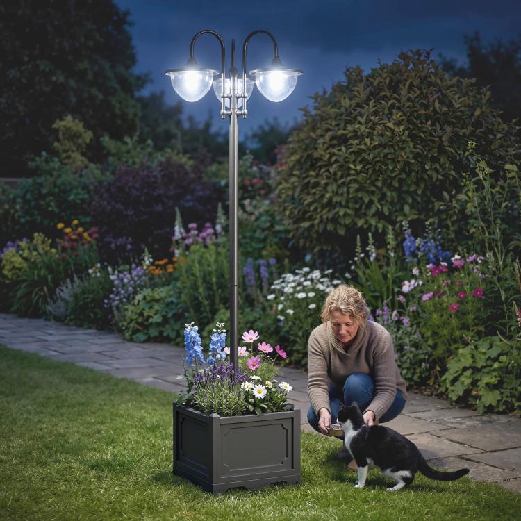 Three-head solar lamp post light with frosted glass shades and square planter box