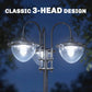 Three-head solar lamp post light close-up with frosted glass shades on dark metal