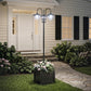 Three-head solar lamp post light with frosted glass shades next to square planter box