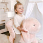 Plush rabbit rocking horse with wooden rockers, toddler holding the rabbit