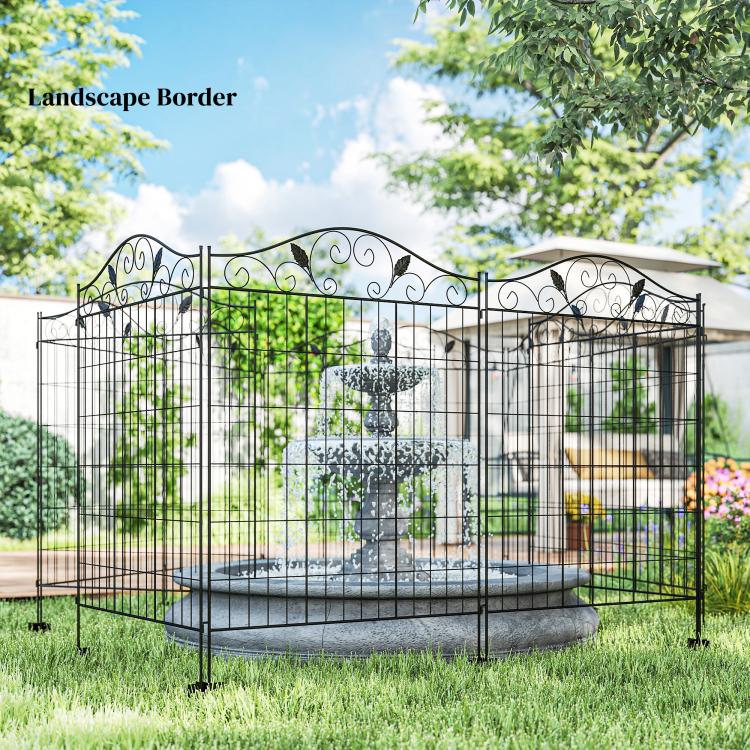 Black metal folding garden fence border around raised bed with scroll top
