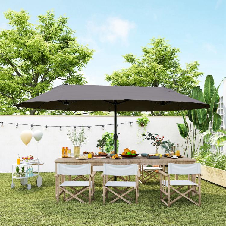 Gray patio umbrella with wide canopy over an outdoor dining table
