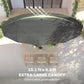 Underside view of dark gray patio umbrella canopy with vented panels